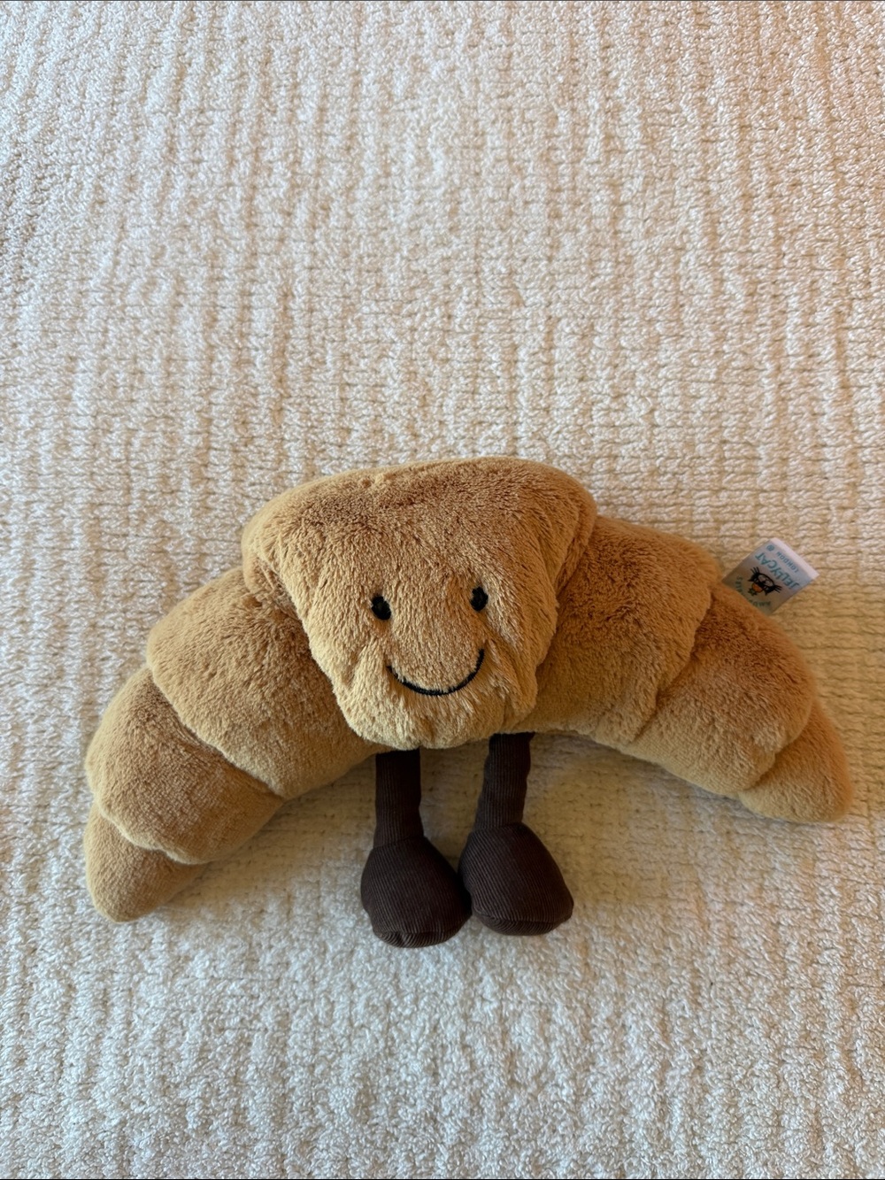 Jellycat Smiling Croissant Plush Pillow - Light Brown with Dark Brown Legs